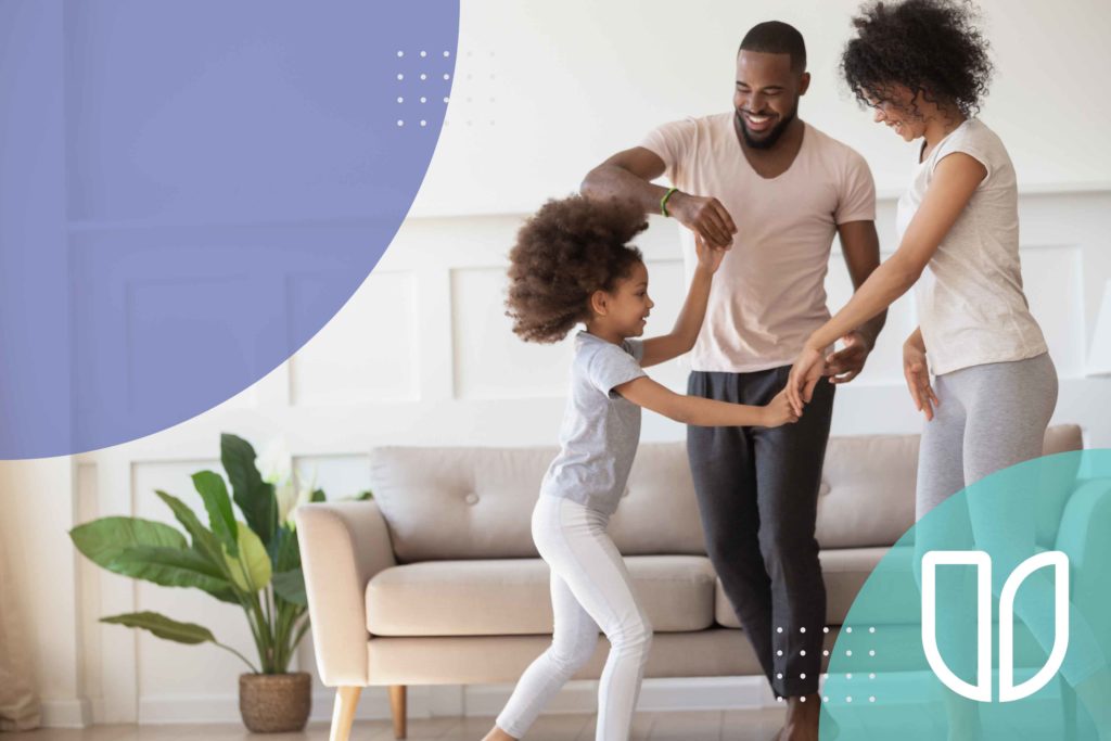 Family dancing in the living room