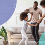 Family dancing in the living room